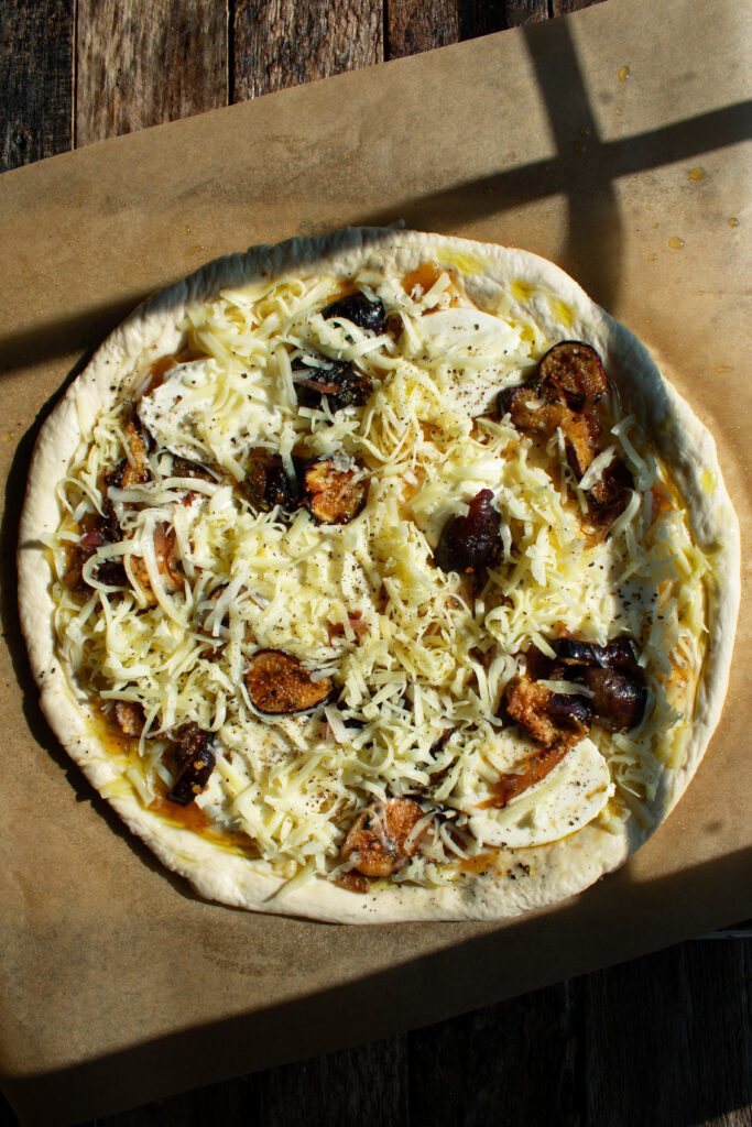 pizza dough topped with figs and cheese