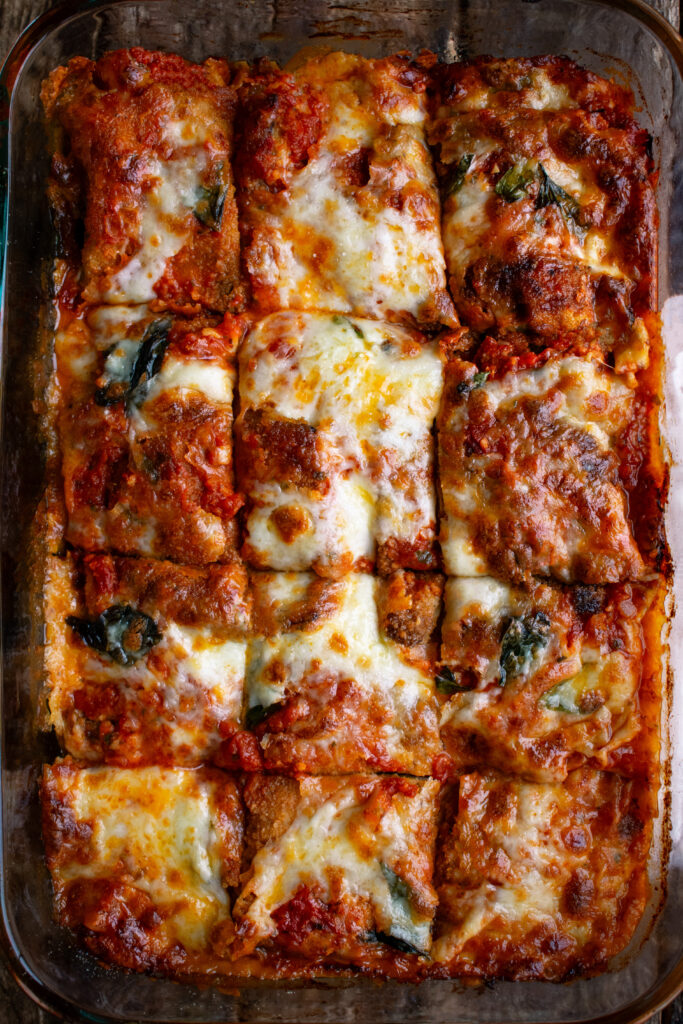 eggplant parmesan out of the oven, sliced into squares