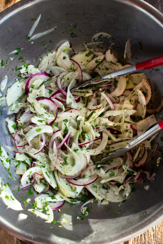 mixing bowl of fennel slaw